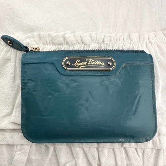 AUTHENTIC Louis Vuitton teal blue coin wallet.